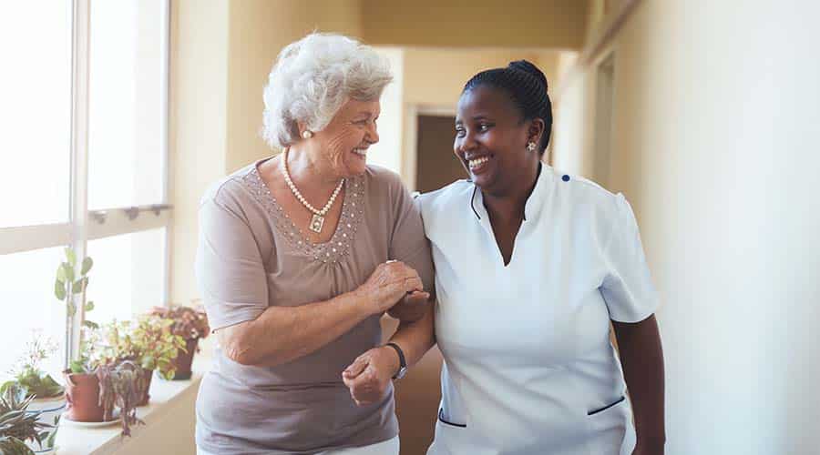A Home Health Aide Helps A Senior With Dementia To Go To Doctor'S Appointments, Hourly Help For Seniors