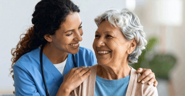 Professional Caregiver Providing Respite Care Assistance To Elderly Client At Home